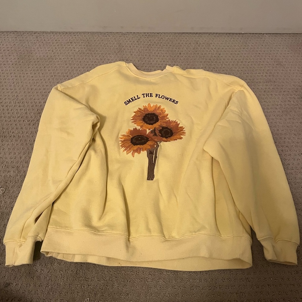 yellow “smell the flowers” crewneck